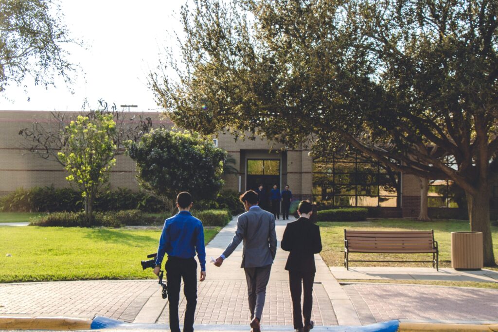 three men walking on a crosswalk. injured in a pedestrian accident blog